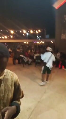Nighttime social gathering with live music in Adankolo, Nigeria