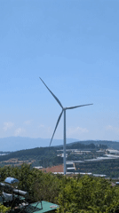 Wind turbine documented from multiple angles in rural Vietnam