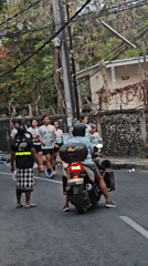 Road race moves through Denpasar streets with crowds and cameras