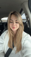Woman drinks coffee, takes selfies while driving on highway