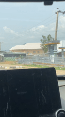 Man kneels in street as witnesses record from vehicles
