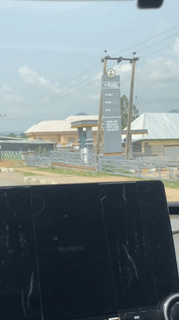 Man kneels in street as witnesses record from vehicles