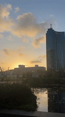 Golden hour sunset illuminates Tel-Aviv's modern skyline