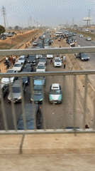 Traffic congestion observed from pedestrian overpass in Abuja