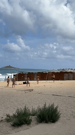 Morning beach activities captured at Italian coastal resort