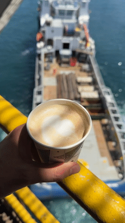 Supply vessel operations at sea, pipes and cargo on deck
