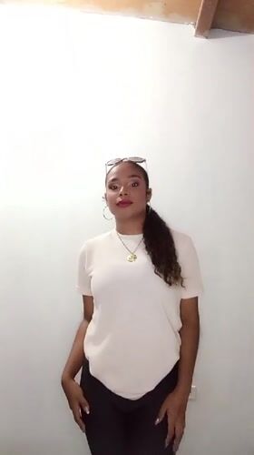 Woman dances indoors in Juan Griego, Venezuela