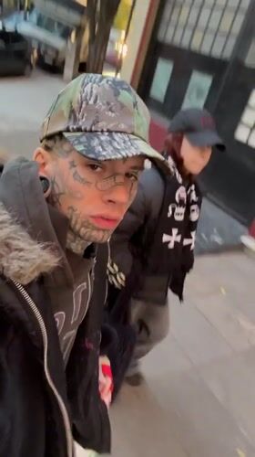 Tattooed individual filmed on Buenos Aires street mentions Iceland trip