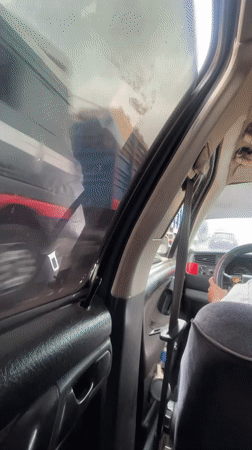 Driver films close train passage from car in Dokwa