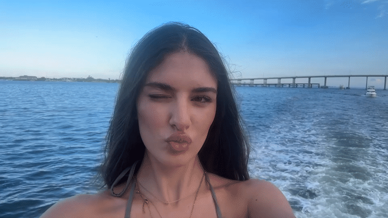 Evening boat ride through Miami bay near bridge