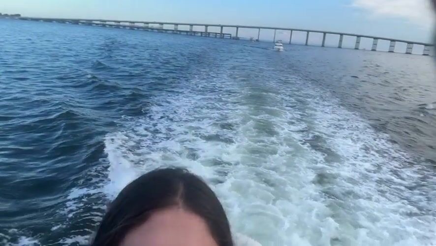 Evening boat ride through Miami bay near bridge