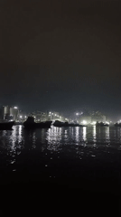 Nighttime industrial waterfront activity recorded in Nagar Kasba, Bangladesh