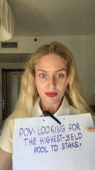 Woman uses magnifying glass in cryptocurrency staking demonstration