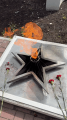 Memorial flame and bird sighted in Glazov, Russia