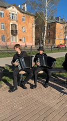 Street musicians perform amid instrument displays in Votkinsk
