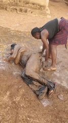 People engage in playful mud activity in Akwanga, Nigeria