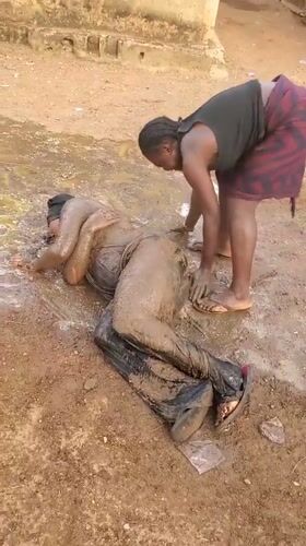 People engage in playful mud activity in Akwanga, Nigeria