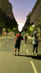 Evening street life captured near Buenos Aires Obelisco monument