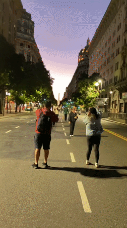 Evening street life captured near Buenos Aires Obelisco monument