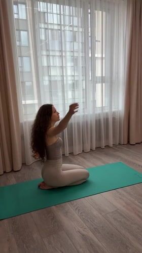 Morning yoga session on a teal mat in Khimki