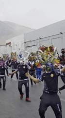 Traditional masked parade marches through Iquique, Chile streets