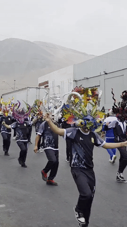 Traditional masked parade marches through Iquique, Chile streets