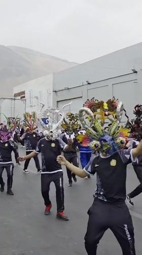 Traditional masked parade marches through Iquique, Chile streets