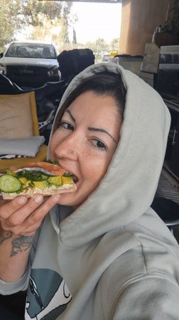 Woman enjoys early morning meal in Israeli countryside