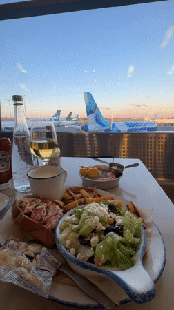 Dining table with airport tarmac views in Boston
