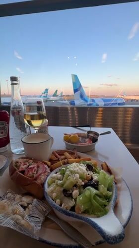Dining table with airport tarmac views in Boston