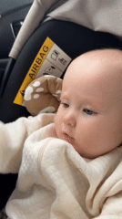 Baby with bead toy observed in car seat in Yakutsk