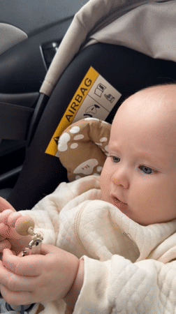 Baby with bead toy observed in car seat in Yakutsk