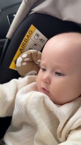 Baby with bead toy observed in car seat in Yakutsk