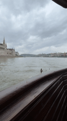 Tourist boat captures Parliament Building views along Budapest's Danube River