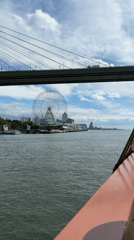 Tall ship passenger documents scenic Osaka Bay cruise views