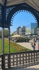 Crowds gather at Stuttgart monument on sunny Saturday morning